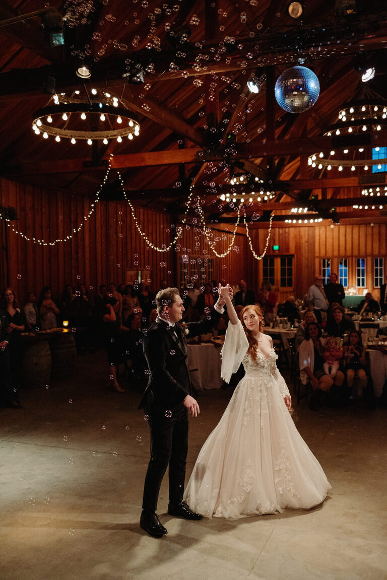 a bride and groom have their first dance in brett Harte hall at roaring camp in the Santa Cruz mountains