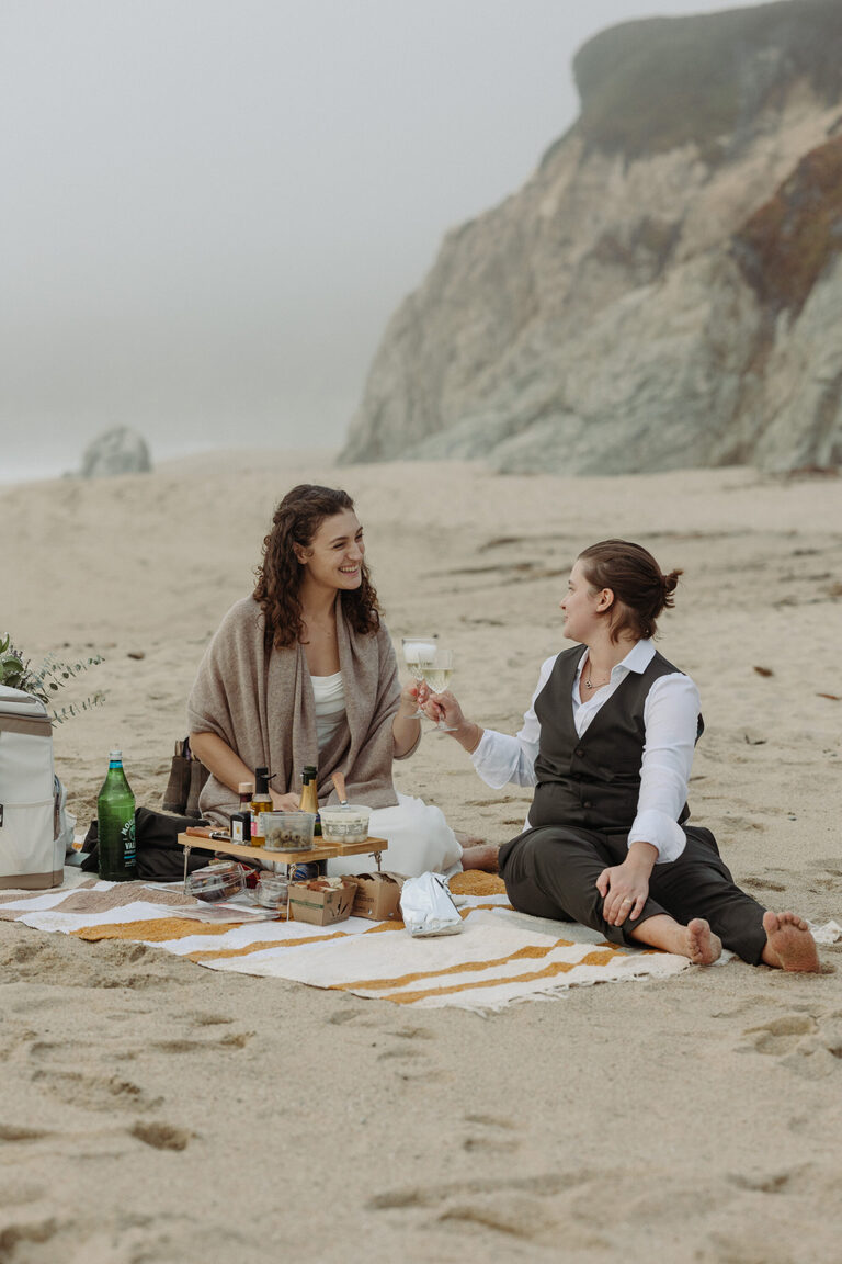 a newlywed couple has a picnic dinner in Big Sur after eloping in the forest