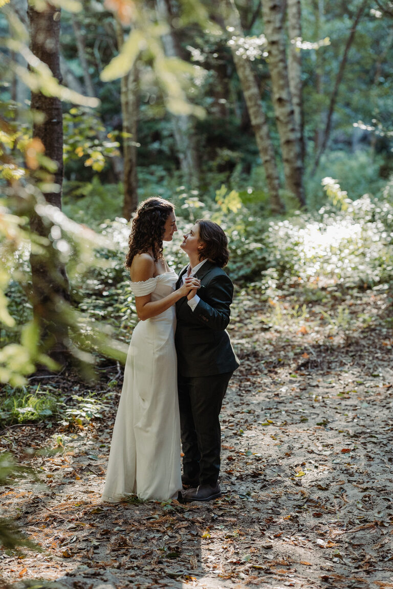newlyweds have their first dance in a forest in Big Sur after eloping