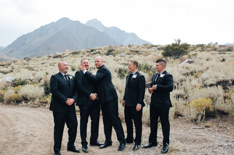 candid groomsmen photo mountain wedding