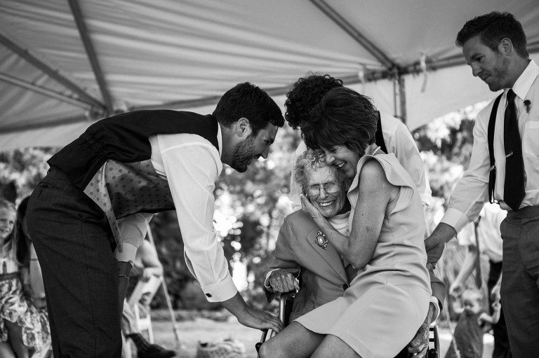 emotional wedding photos grandmother with groom