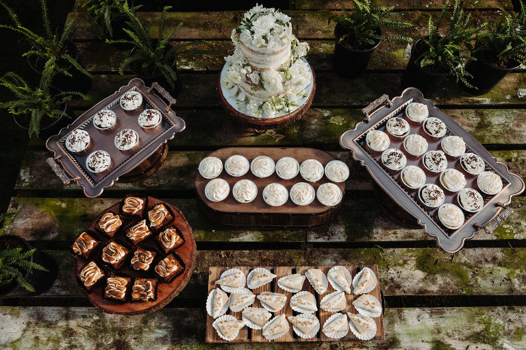 wedding dessert table in a greenhouse