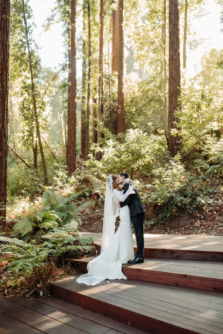 Best Wedding Venues in Santa Cruz / newlywed couple kisses after ceremony