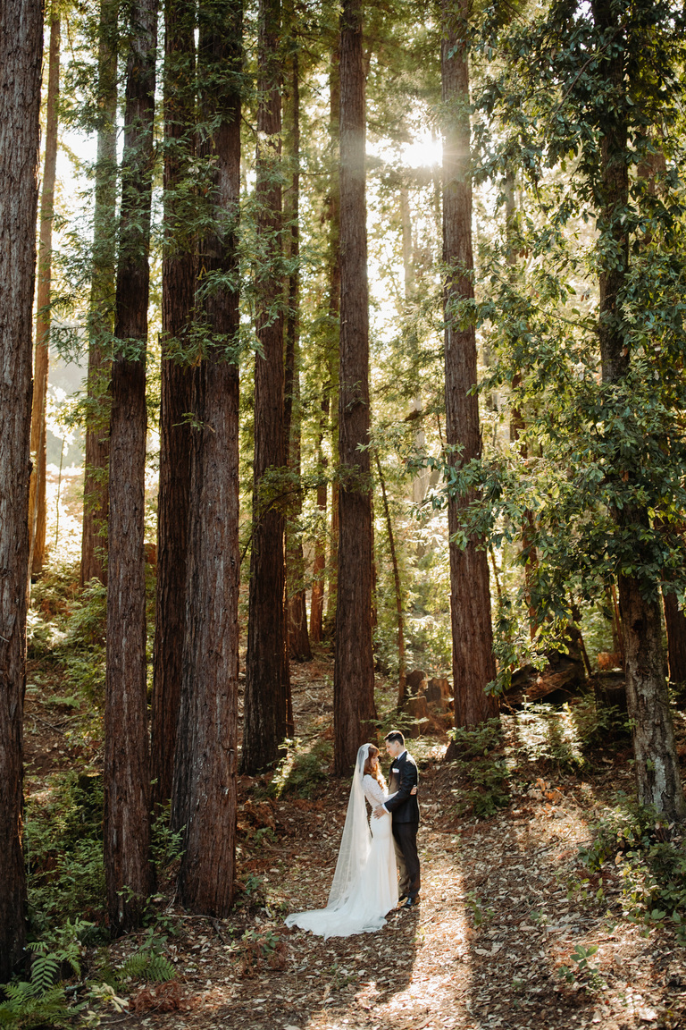 A couple embraces after their ceremony at Sparrow Valley Retreat, one of the best redwood forest wedding venues in California